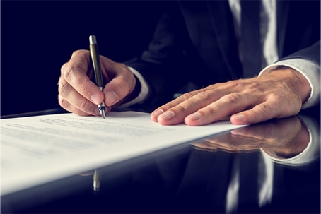 Man signing a document